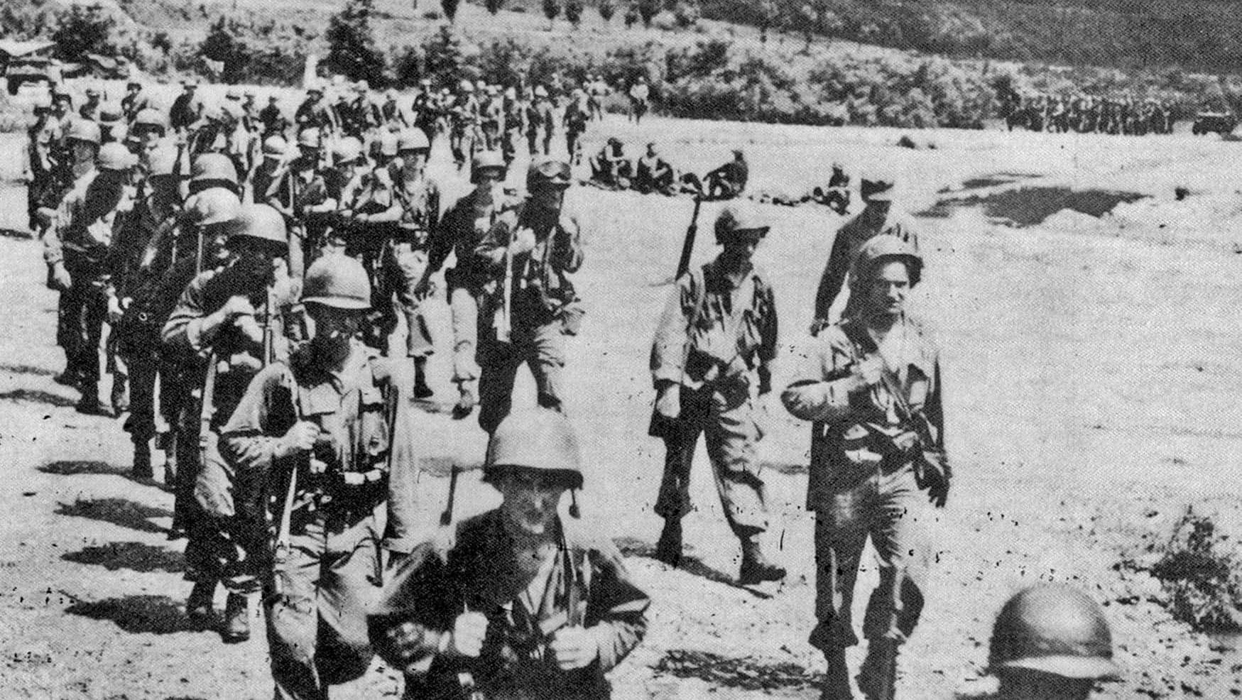 U.S. 1st Cavalry Division troops withdraw southward on July 29, 1950, the day a division battalion pulled back from No Gun Ri after killing large numbers of trapped South Korean refugees there.