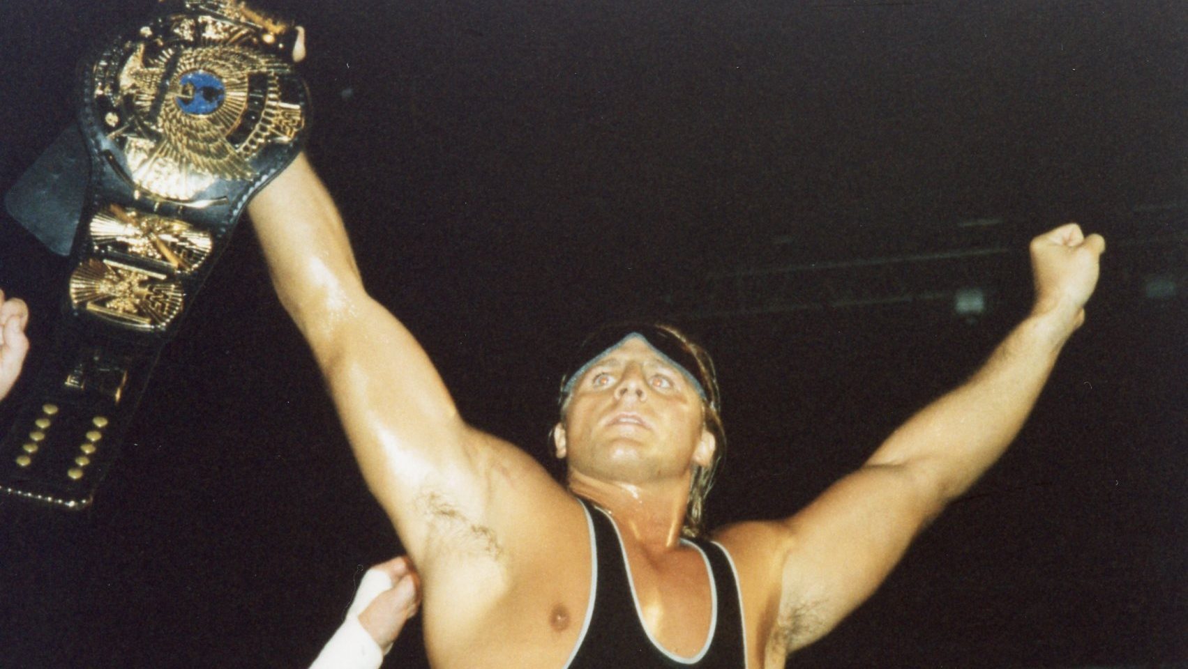 Professional wrestler Owen Hart with the WWF Championship, the only major championship in the WWF that he didn't win.