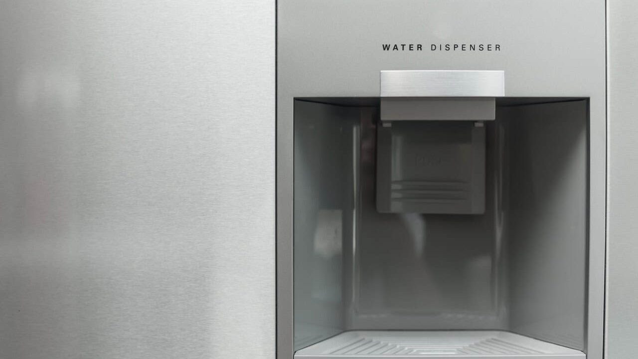Water dispenser in modern steel fridge