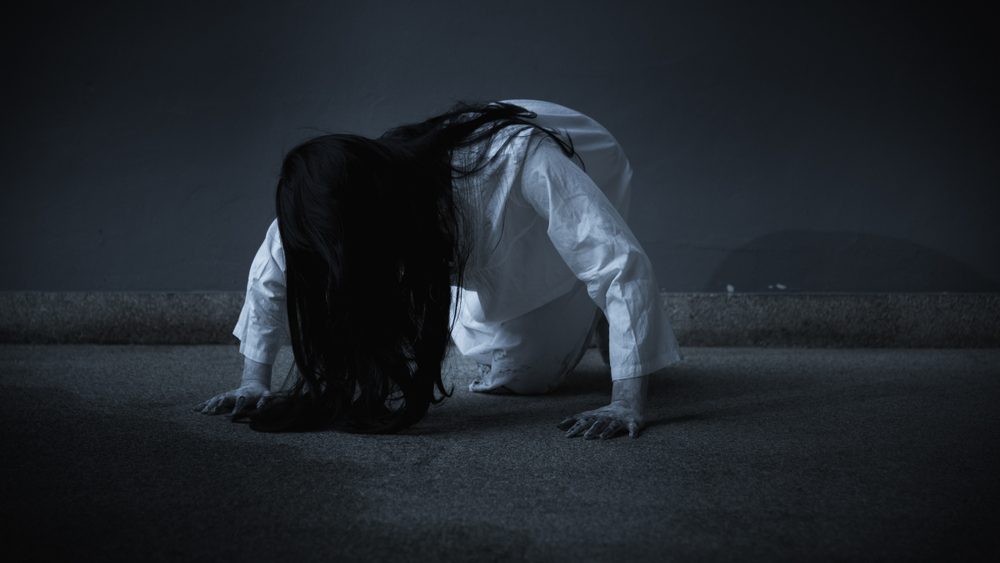 Horror scary woman ghost or Zombie creepy crawling move slowly creeping out, Halloween day concept
