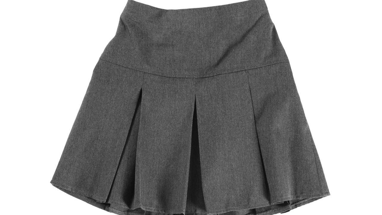 Grey skirt isolated on white, top view. Stylish school uniform