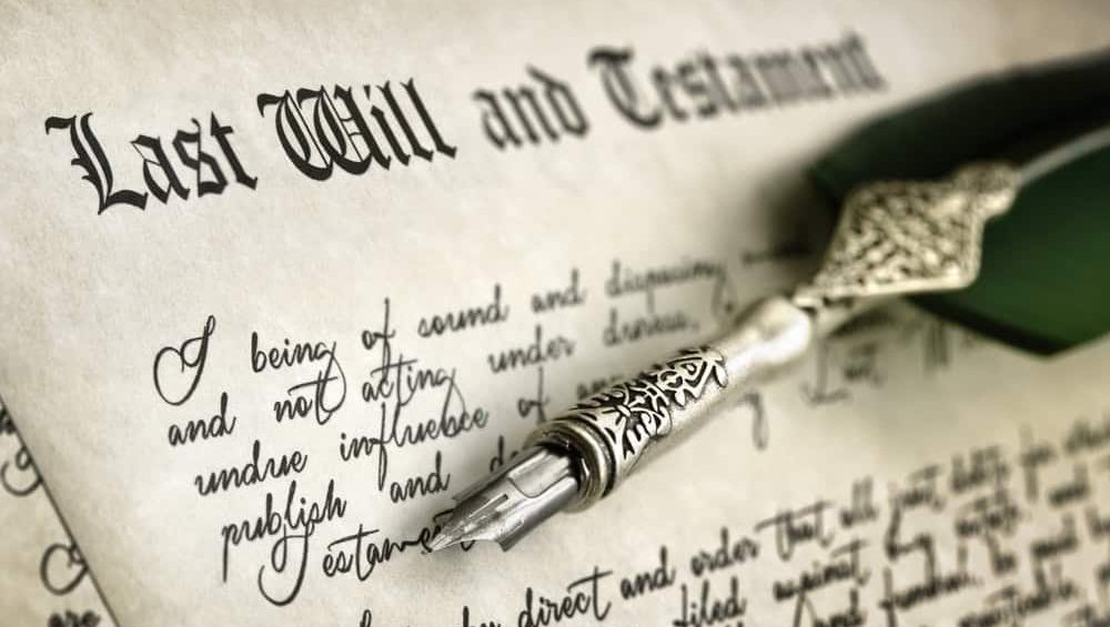 Last Will and Testament document with quill pen and handwriting