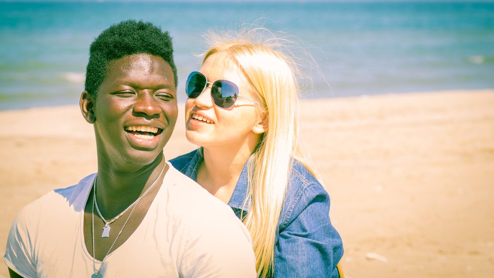 Interracial couple on the beach