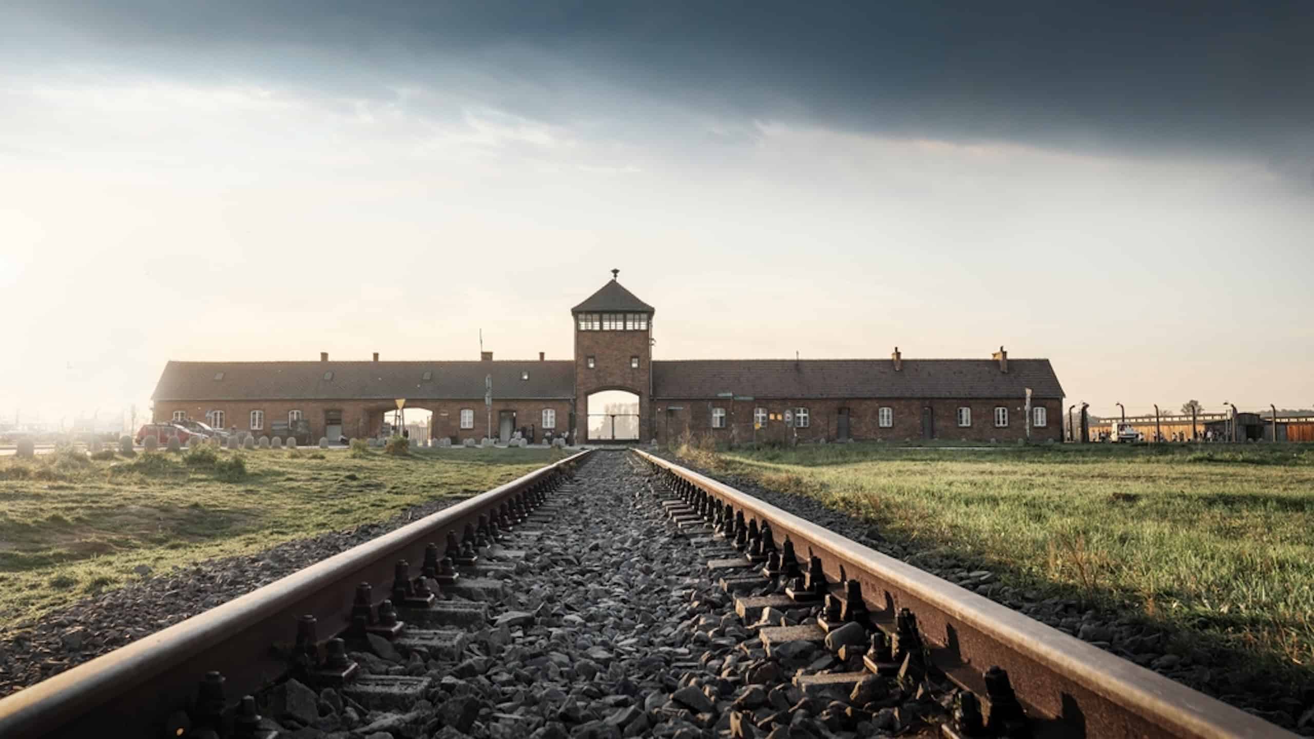 Railroad Track and the Gate of Death - Entrance of Auschwitz II - Birkenau, former German Nazi Concentration and Extermination Camp - Poland