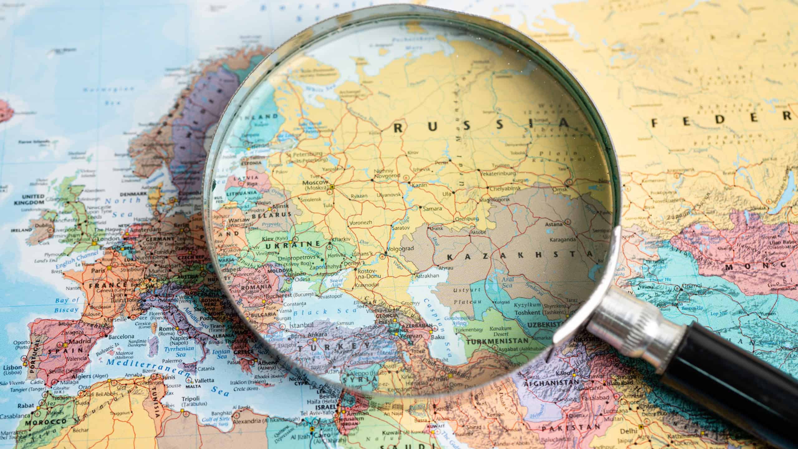 May 01, 2022 Russia and Ukraine, Magnifying glass close up with colorful world map