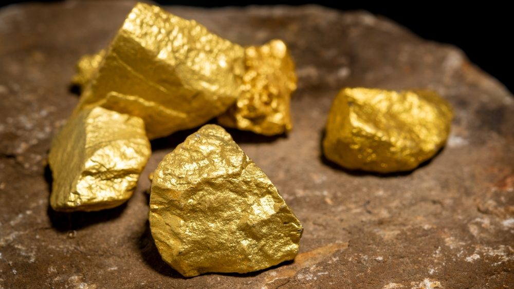 The pure gold ore found in the mine on a stone floor