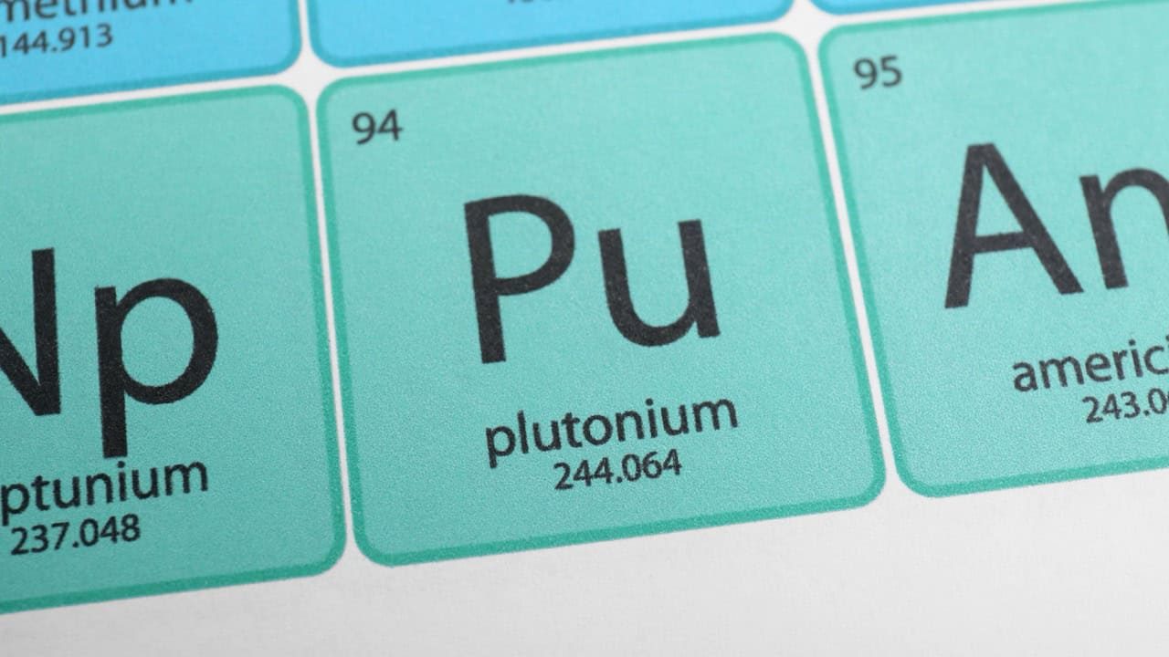 Symbol Plutonium on periodic table of chemical elements, closeup view
