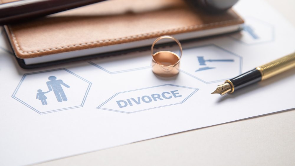 Document and wedding rings. Divorce