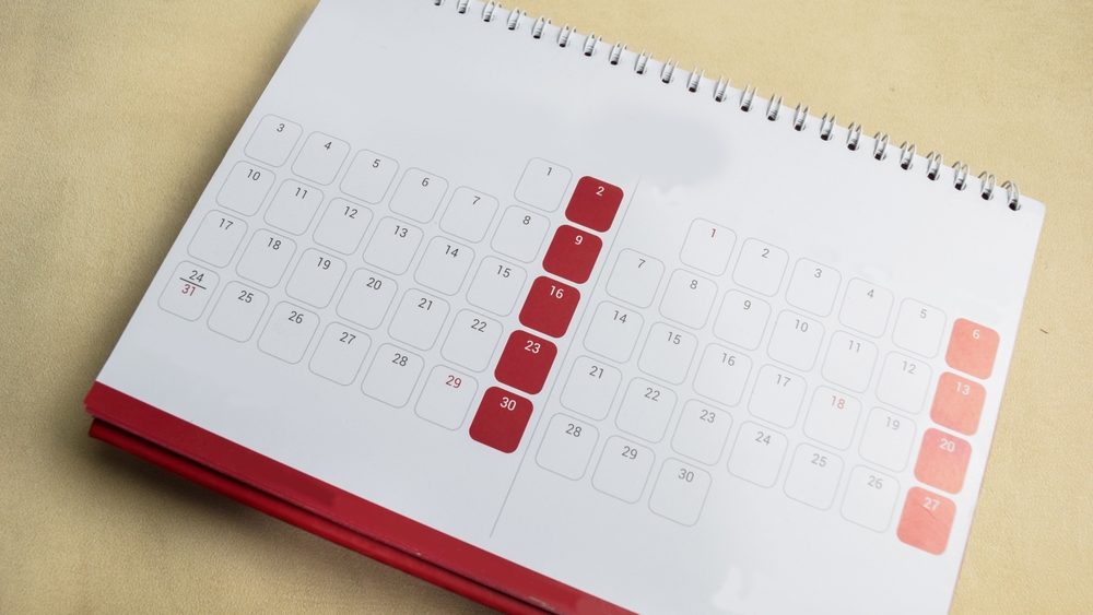 Blank Notepad sheet and Calendar with Save the date. Day of the year concept.