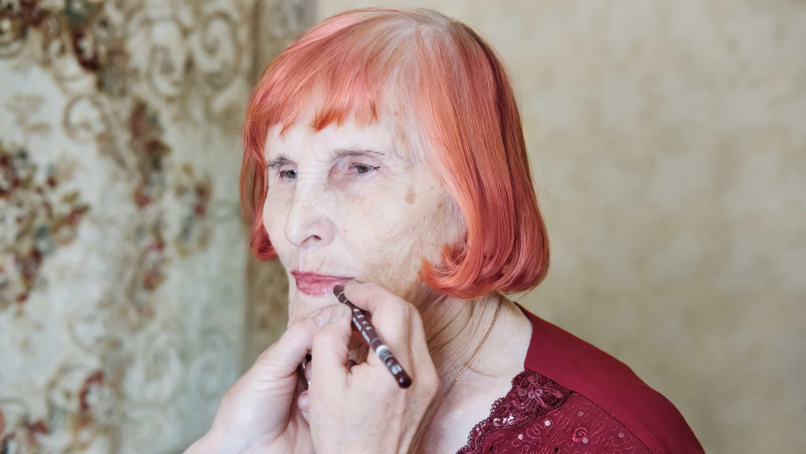 Elderly,Caucasian,Female,Receiving,Makeup,Touch-up,At,Home