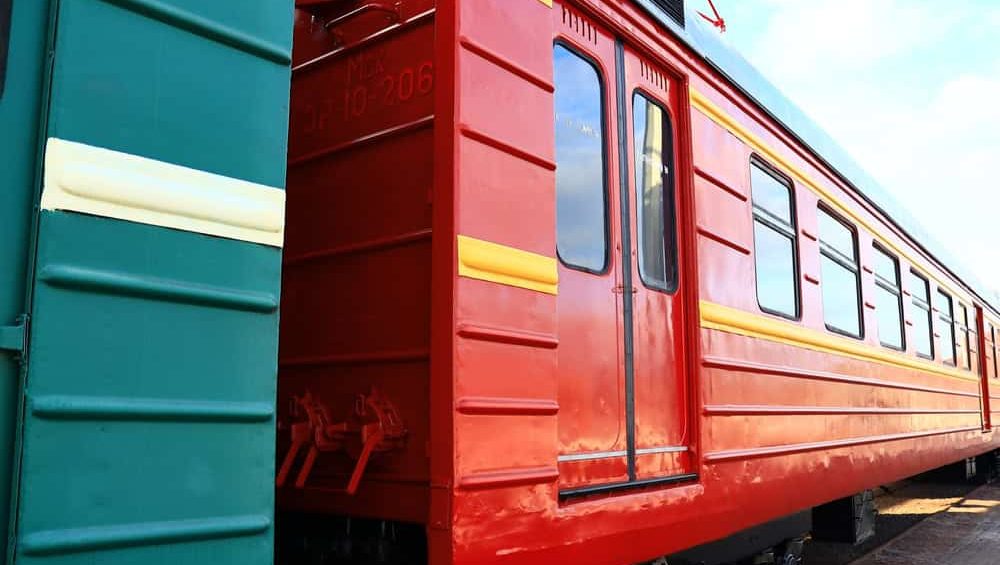 Russia, St. Petersburg, September 9, 2020 A locomotive with bright colors sitting idle on railway tracks.