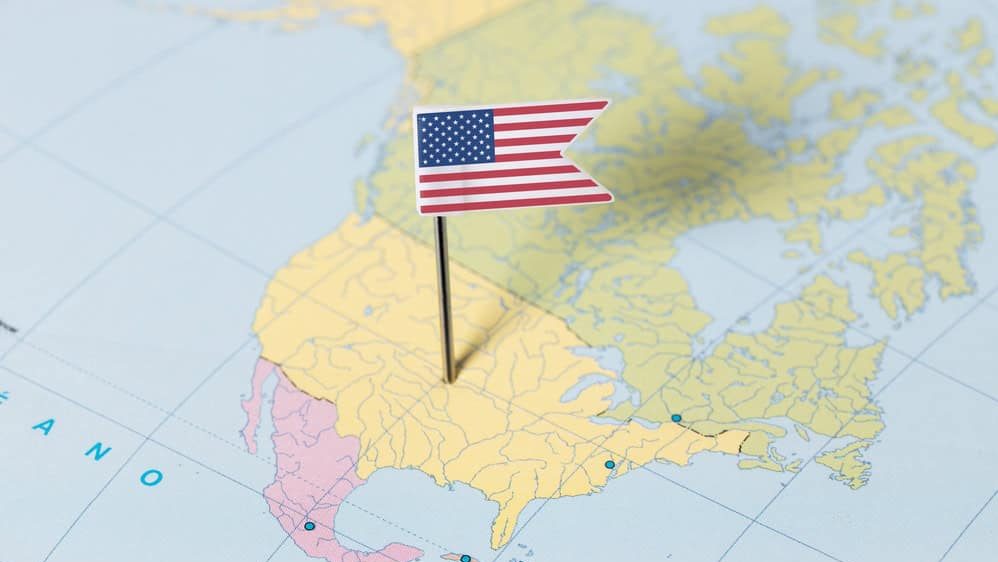 USA flag pin on North America map