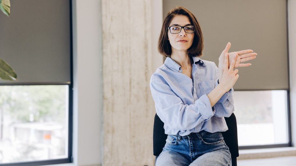 Beautiful woman explaining something using sign language communication concept