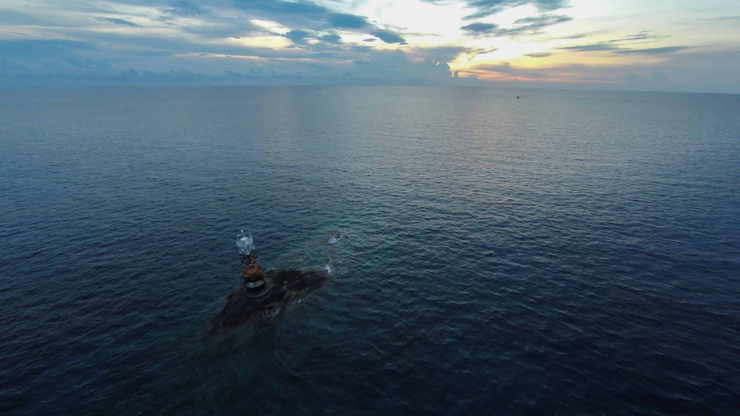 Ocean sea sunset view and lighthouse. Gulf of Thailand sea, Thailand, Wide angle view.
