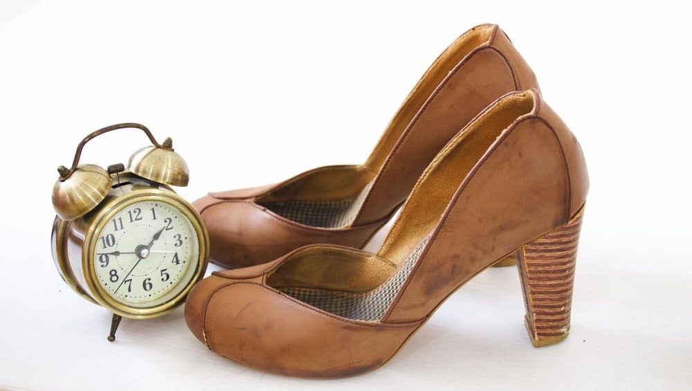 Clock,And,Brown,High,Heel,Shoes,On,White,Background.,Idea