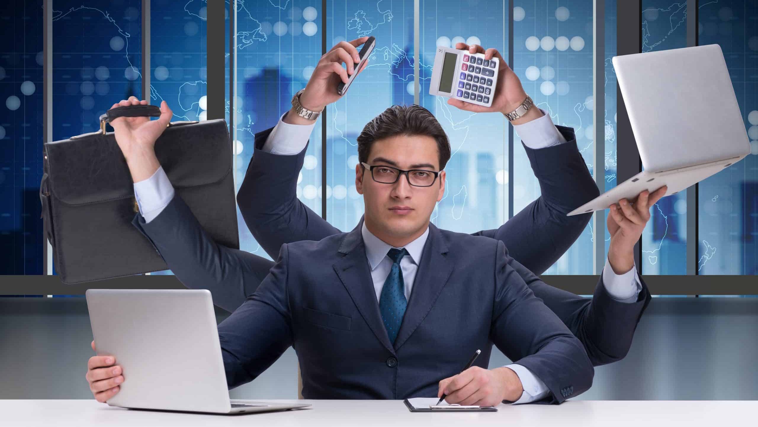 Young businessman in multitasking concept