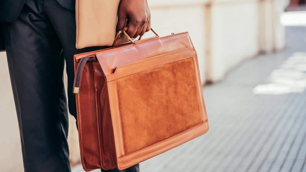 Business man holding a briefcase.