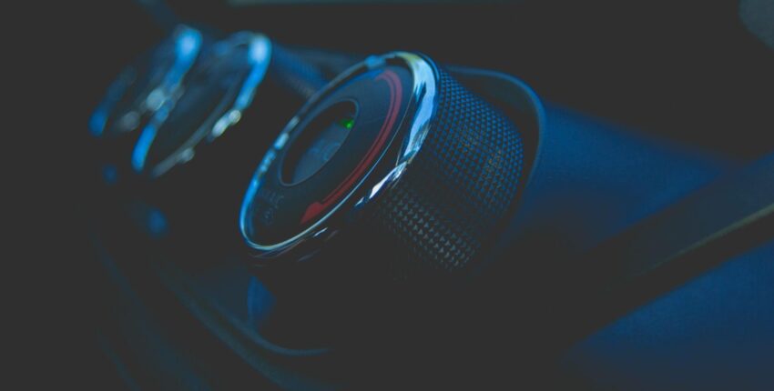 Car air conditioning fan unit inside vehicle dashboard for optimal cooling.