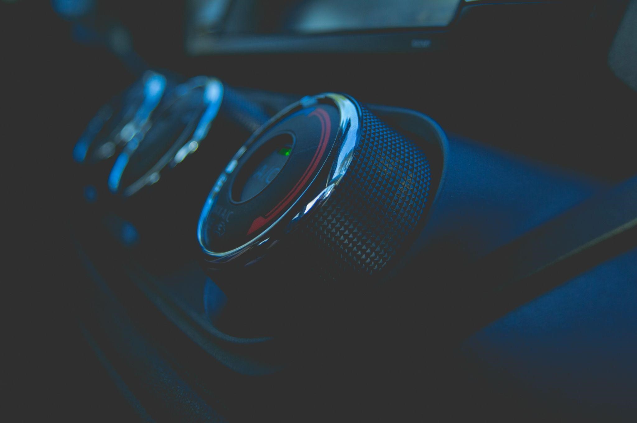 Car air conditioning fan unit inside vehicle dashboard for optimal cooling.