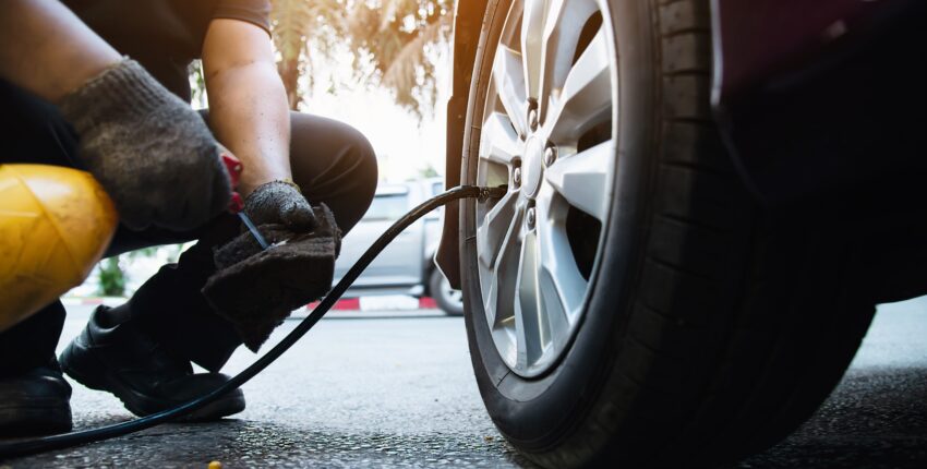Tire alignment being performed on a vehicle at Auburn Service Center.