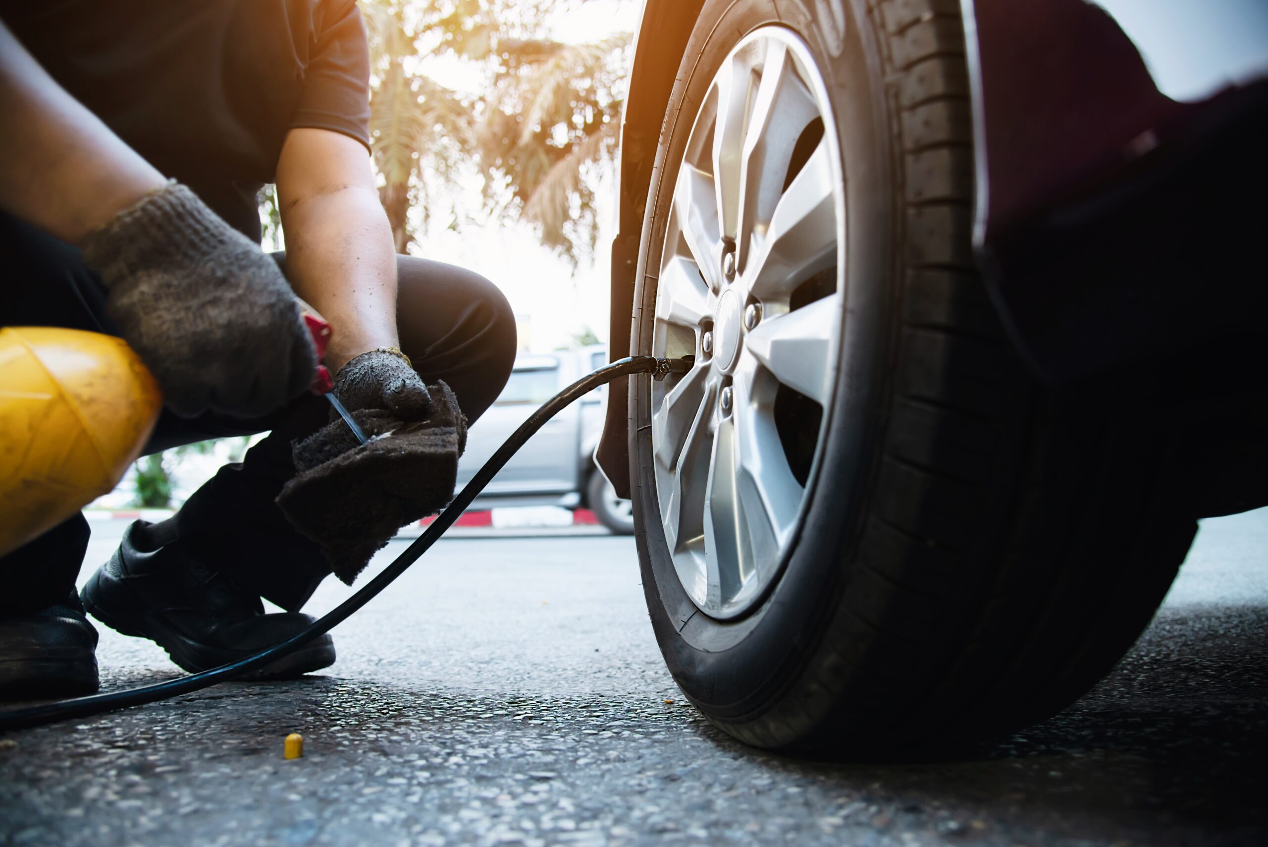 Tire alignment being performed on a vehicle at Auburn Service Center.