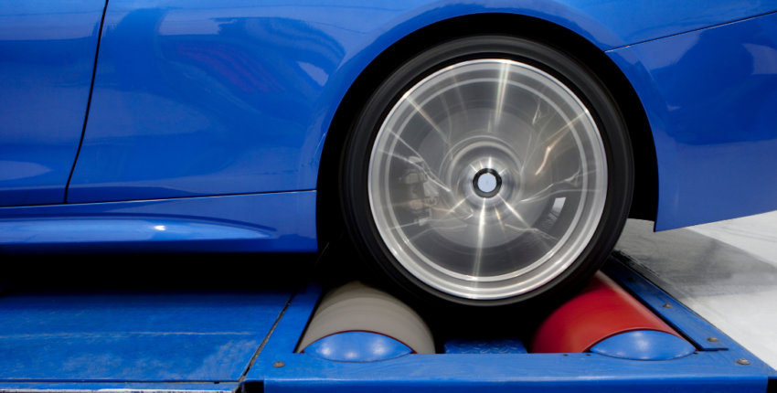 Vehicle on a dynamometer for tuning and performance testing.