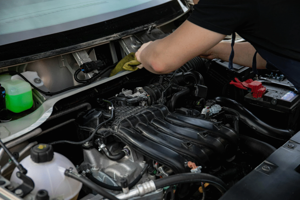 Auto diagnostics technician inspecting engine for optimal performance.