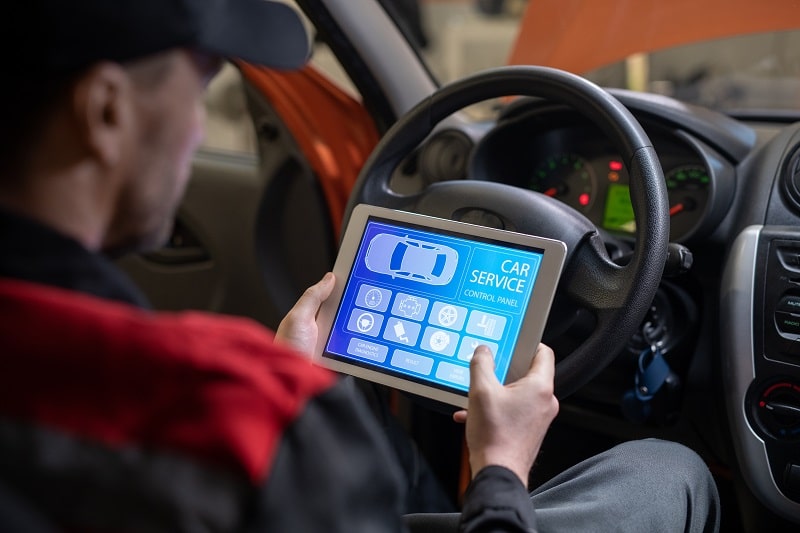 Vehicle diagnostic testing using advanced tools at Auto Tech Solutions.