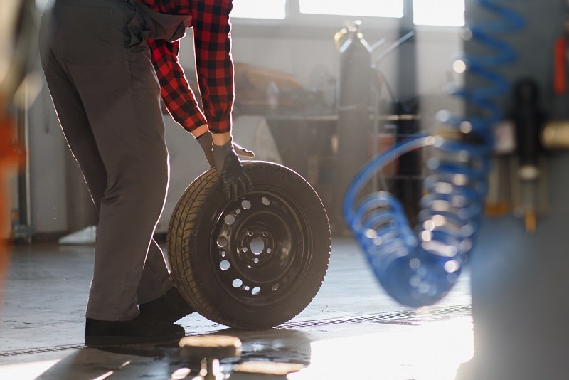 Tire change and repair services at Auto Tech Solutions. Expert automotive technicians ensuring safet.