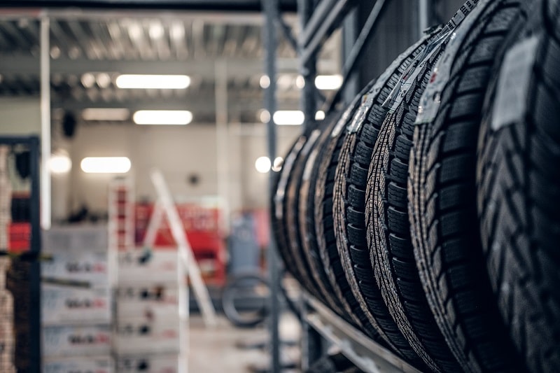Tires stored on racks at Auto Tech Solutions, ready for maintenance or replacement.