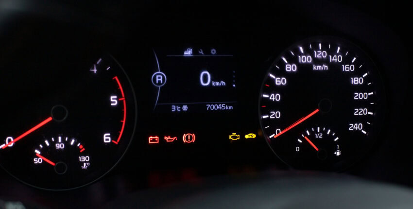 Winter vehicle warning lights on dashboard with illuminated icons.