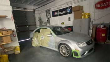 Car undergoing repair at Aventura Motor Service Inc, specializing in auto maintenance and collision.