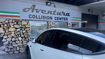Aventura Motor Service collision center exterior with a car parked outside.