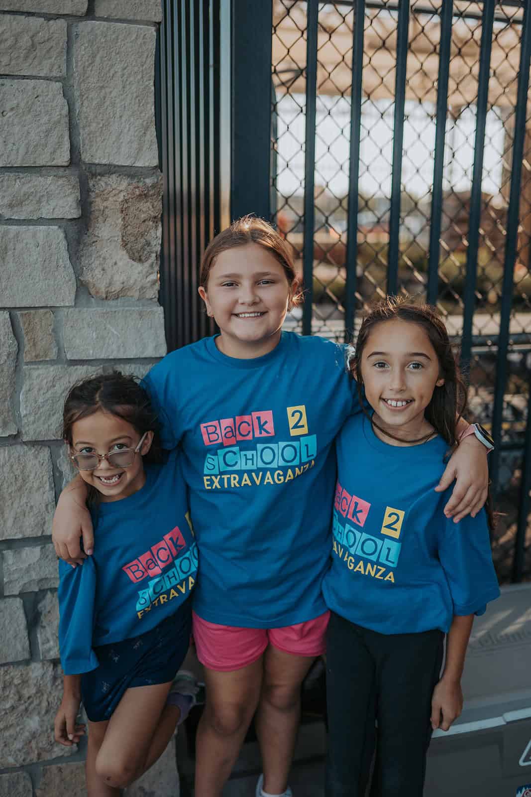 Three young girls with Back to School Extravaganza Shirts