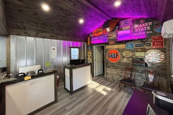 Auto repair shop reception area with vintage signs and modern decor.