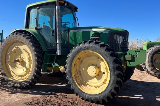 Agricultural tires on a green tractor for farming and fieldwork. Durable and reliable tires designed.