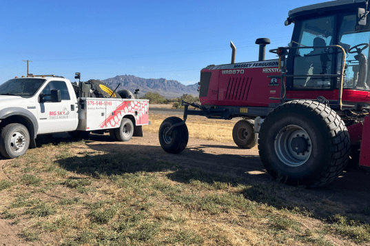 Agricultural tires on heavy machinery for farm equipment maintenance and repair.