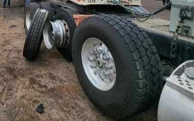 Large truck tire on a heavy-duty vehicle for tire repair and maintenance.