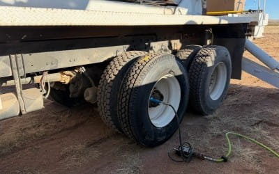 Large truck tires being repaired on roadside in Big Sky, Montana.