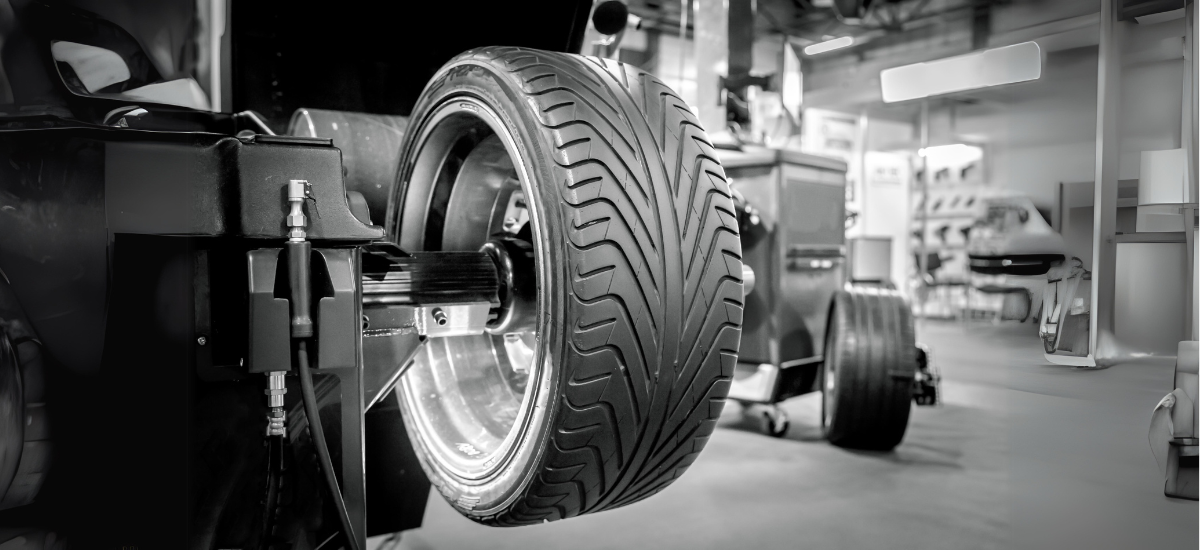 Tire balancing being performed on a vehicle at Black n Rounds ATX.