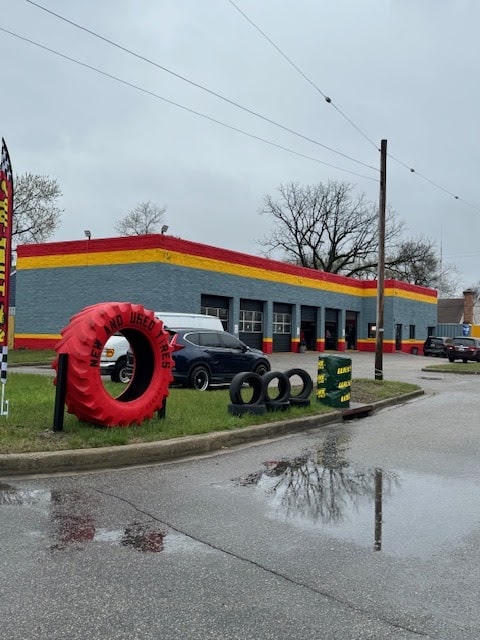 Auto repair shop with tire display and service bays.
