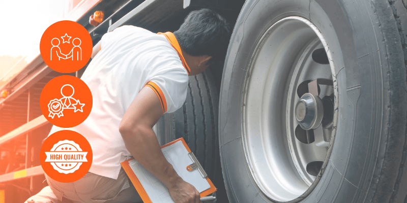 Technician inspecting vehicle tires at Blas Auto Service for safety and quality.