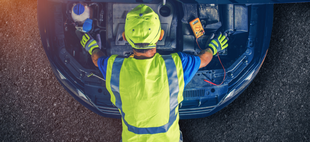 Auto repair technician inspecting car engine in Glen Burnie.