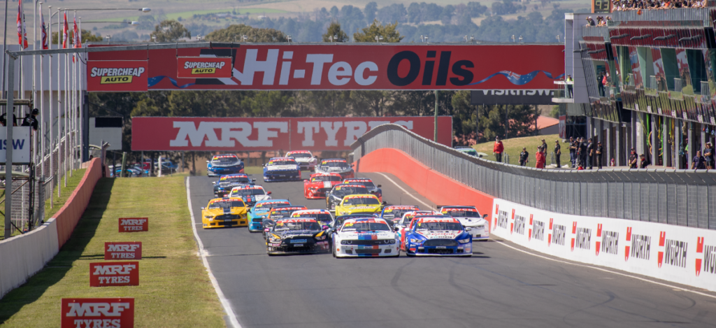 Race cars speeding on a professional auto racing track in Glen Burnie. Expert auto repair and mainte.