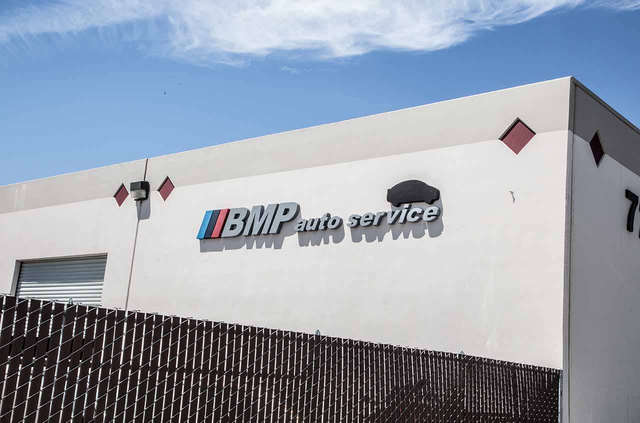 BMP Auto Service auto repair shop exterior with signage and building facade.