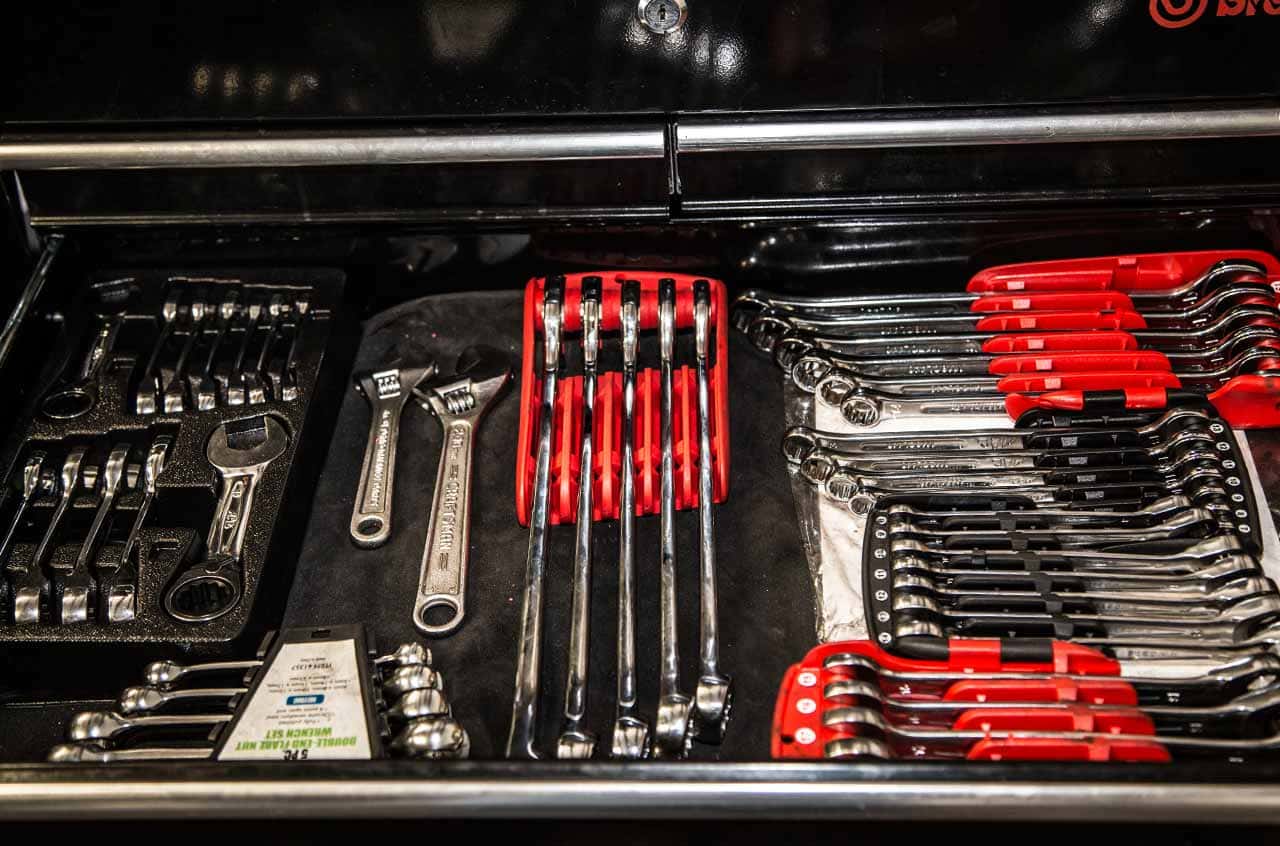 Engine repair tools and wrenches at BMP Auto Service workshop.