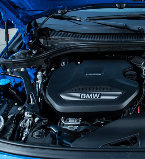 BMW engine with TWINPOWER TURBO label in a car engine bay.