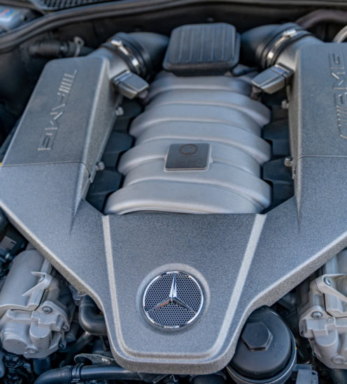 Mercedes-Benz engine with clean, well-maintained components in the engine bay.