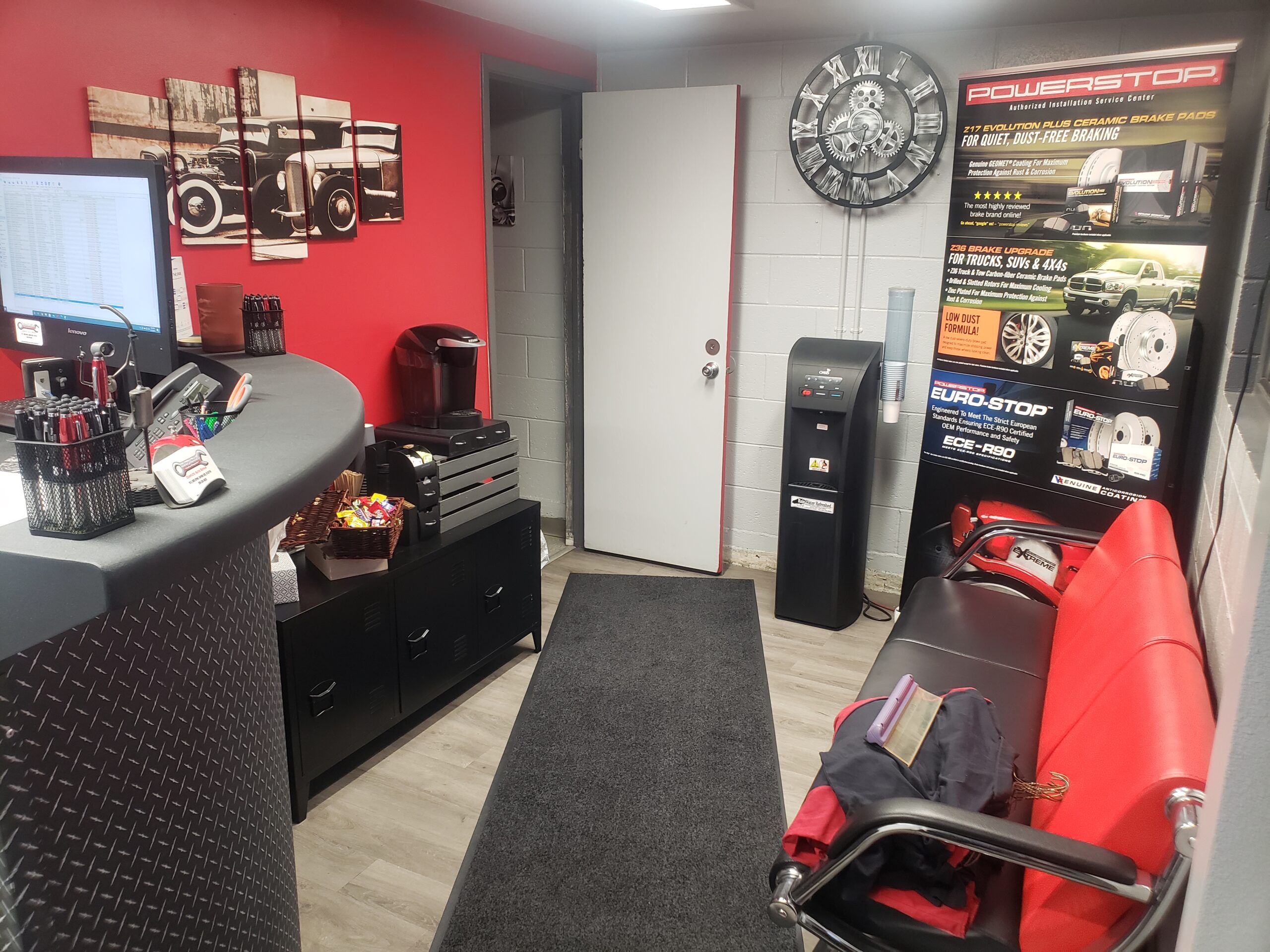 Interior view of Boise Muffler Auto Repair shop with reception desk and waiting area.