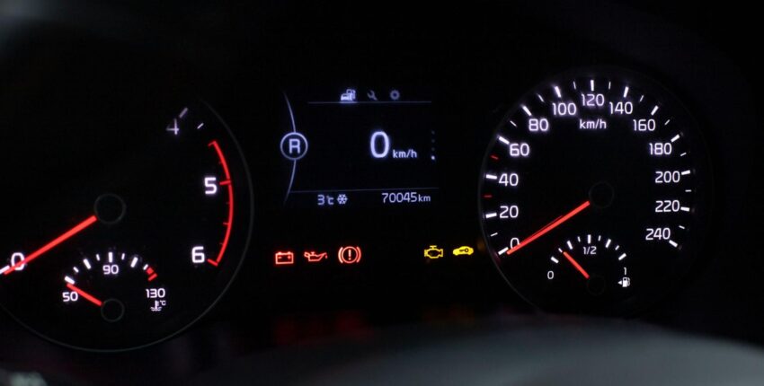 Check Engine Light on dashboard indicating potential vehicle issues.